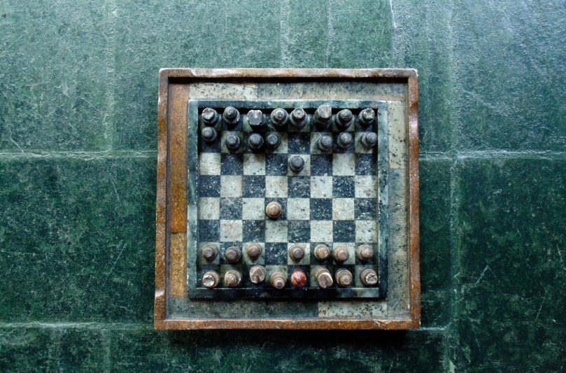 old chess set on stone